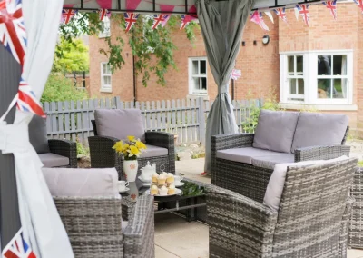 Beautifully set-up garden area, beneath a canopy and afternoon tea for residents their families to enjoy at Pelsall Hall in Walsall