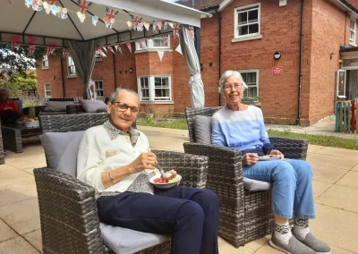 Residents enjoying the accessible garden area at Pelsall Hall in Walsall