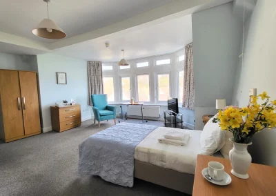 comfortable bedroom at Grosvenor House Care Home in St-Leonards-on-sea
