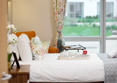 Resident bedroom with tea tray and garden view at Clarendon Lodge Care Home