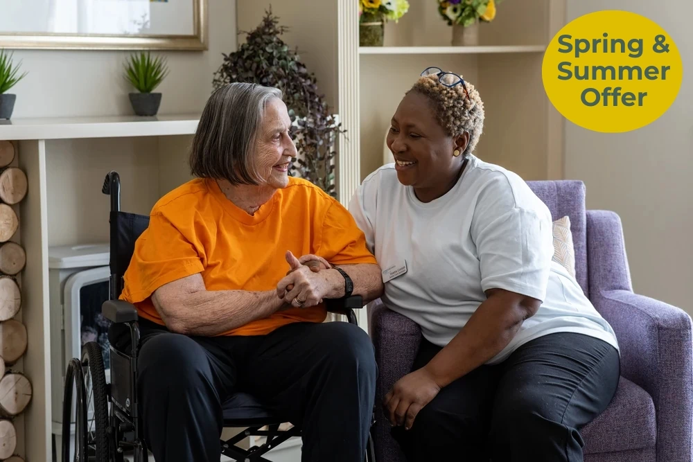 Greensleeves Care home resident interacting with a staff member