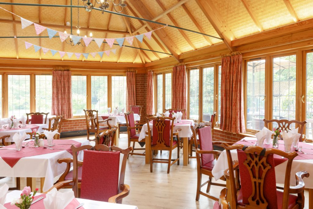 Festive dining room with banquet tables in Broadacres