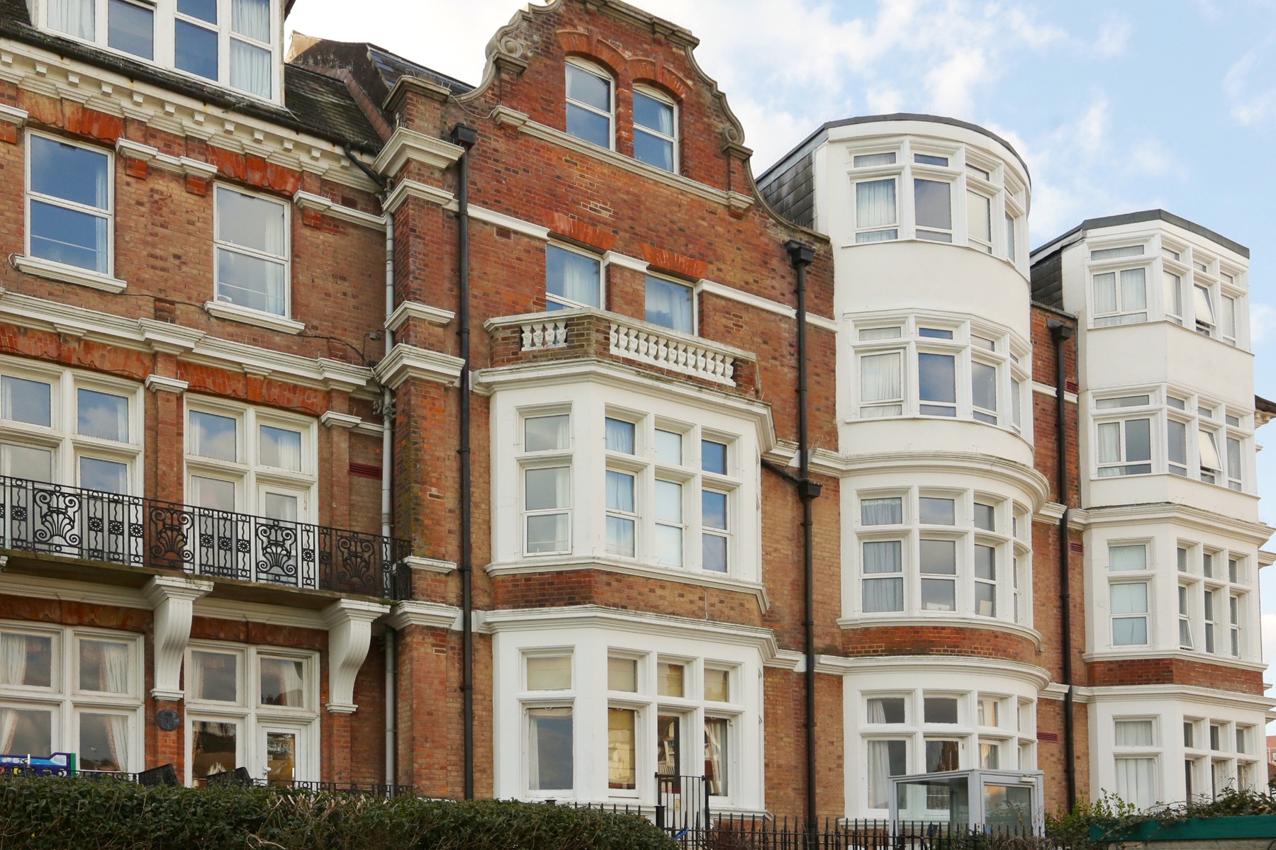 Grosvenor House Georgian brick facade and bay windows