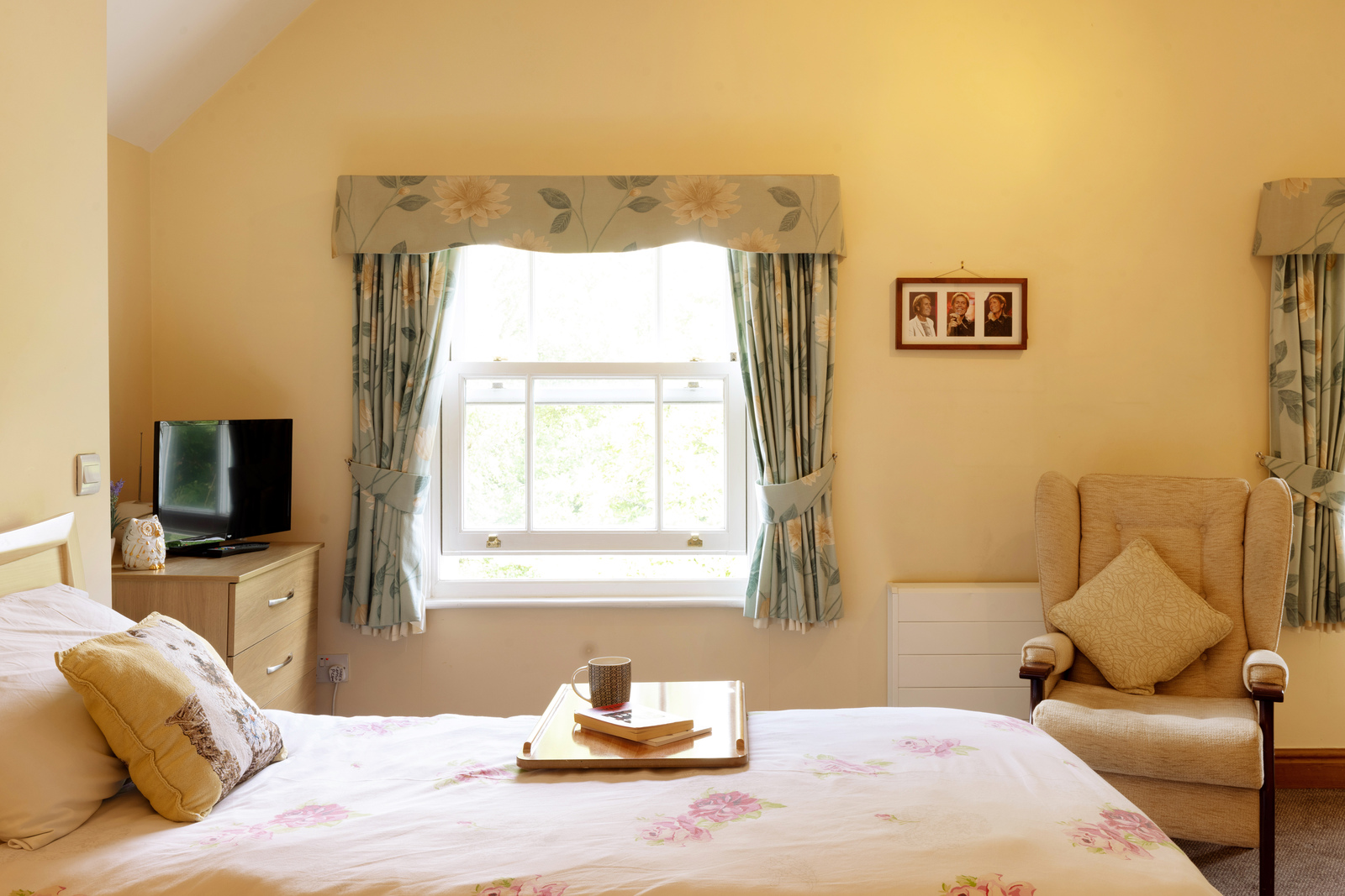 Floral curtained bedroom window at Pelsall Hall, Staffordshire