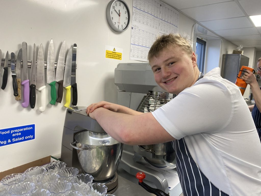 Apprentice chef training at Greensleeves Care catering kitchen
