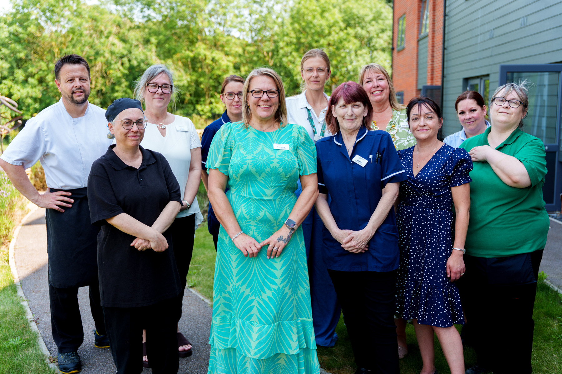 Care Home team posing outside Henley House in Ipswich
